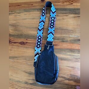 Black leather crossbody sling with cool Navajo design strap
